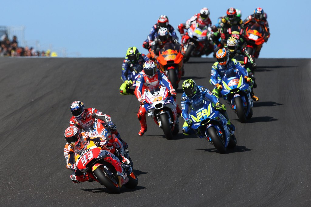 Marc Márquez, riding his Repsol Honda, leading the pack on the opening lap of the 2018 Australian Grand Prix